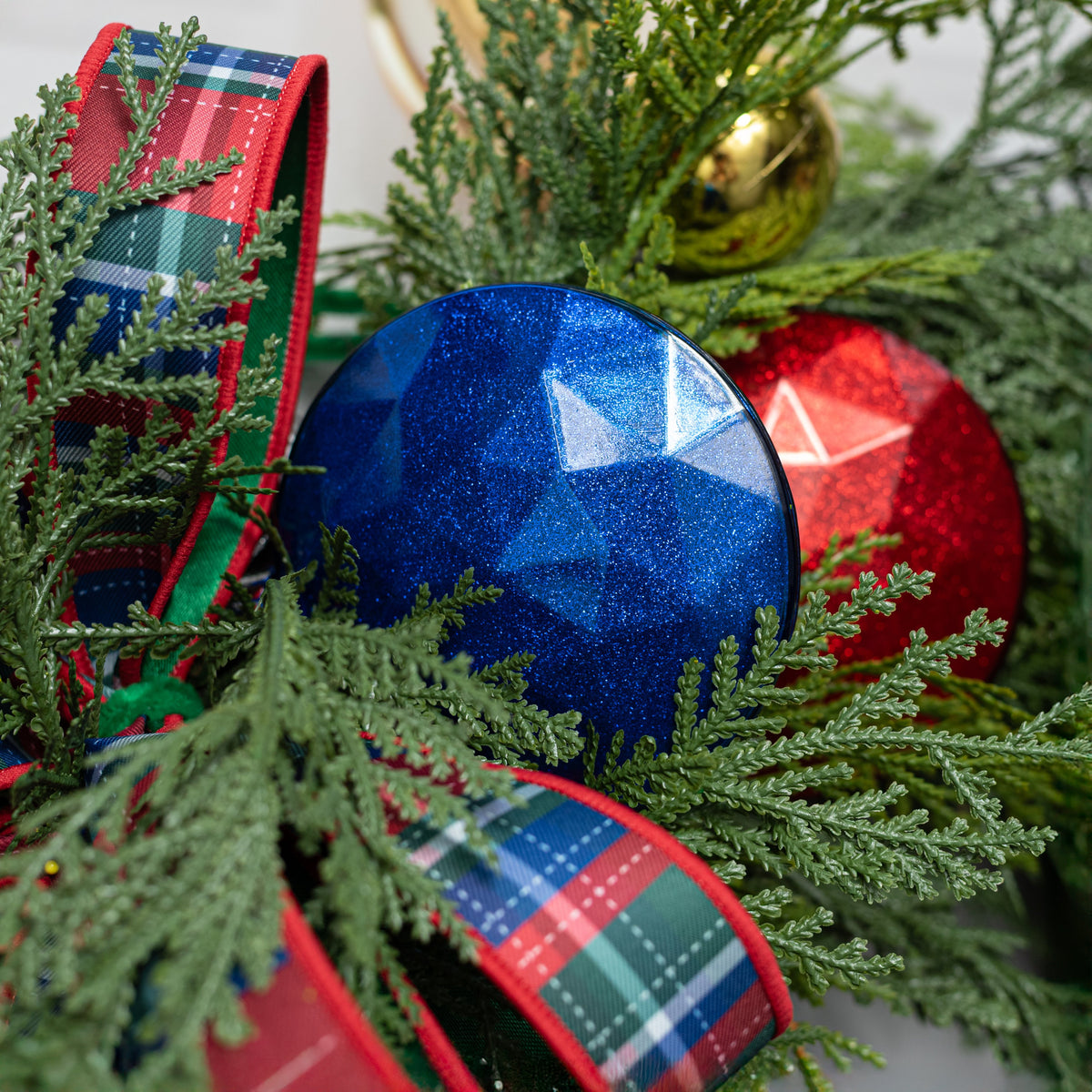 100mm Faceted Flat Round Gem Ornament: Glitter Inside Royal Blue Lifestyle Photo