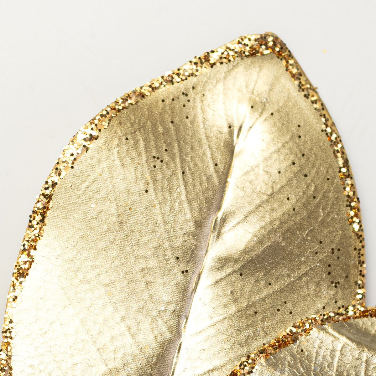 24" Metallic Magnolia Leaves Spray: Light Gold Lifestyle Photo