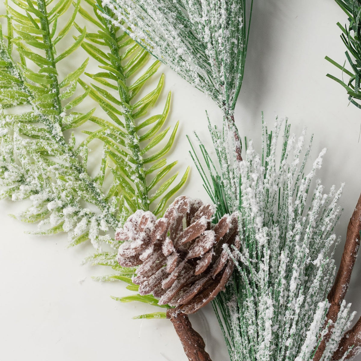 25" Heavy Snow Flocked Mixed Pine Spray Lifestyle Photo