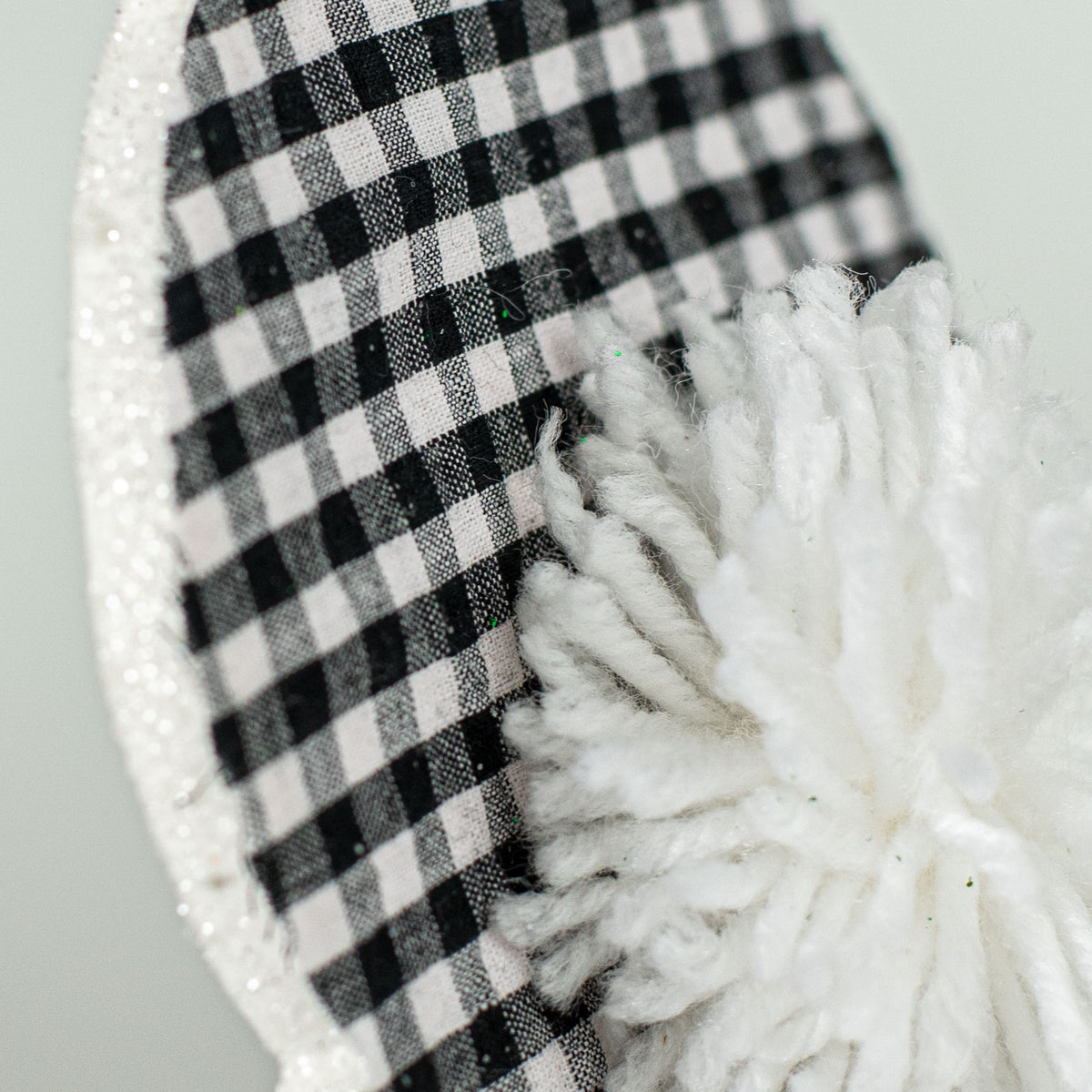 21" Check Bunny Pom Pom Tail Pick: Black Lifestyle Photo