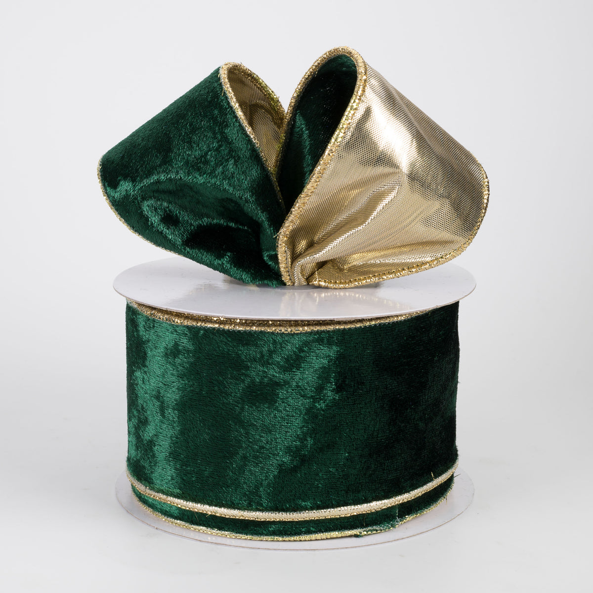 Green velvet ribbon with gold edge on a white background