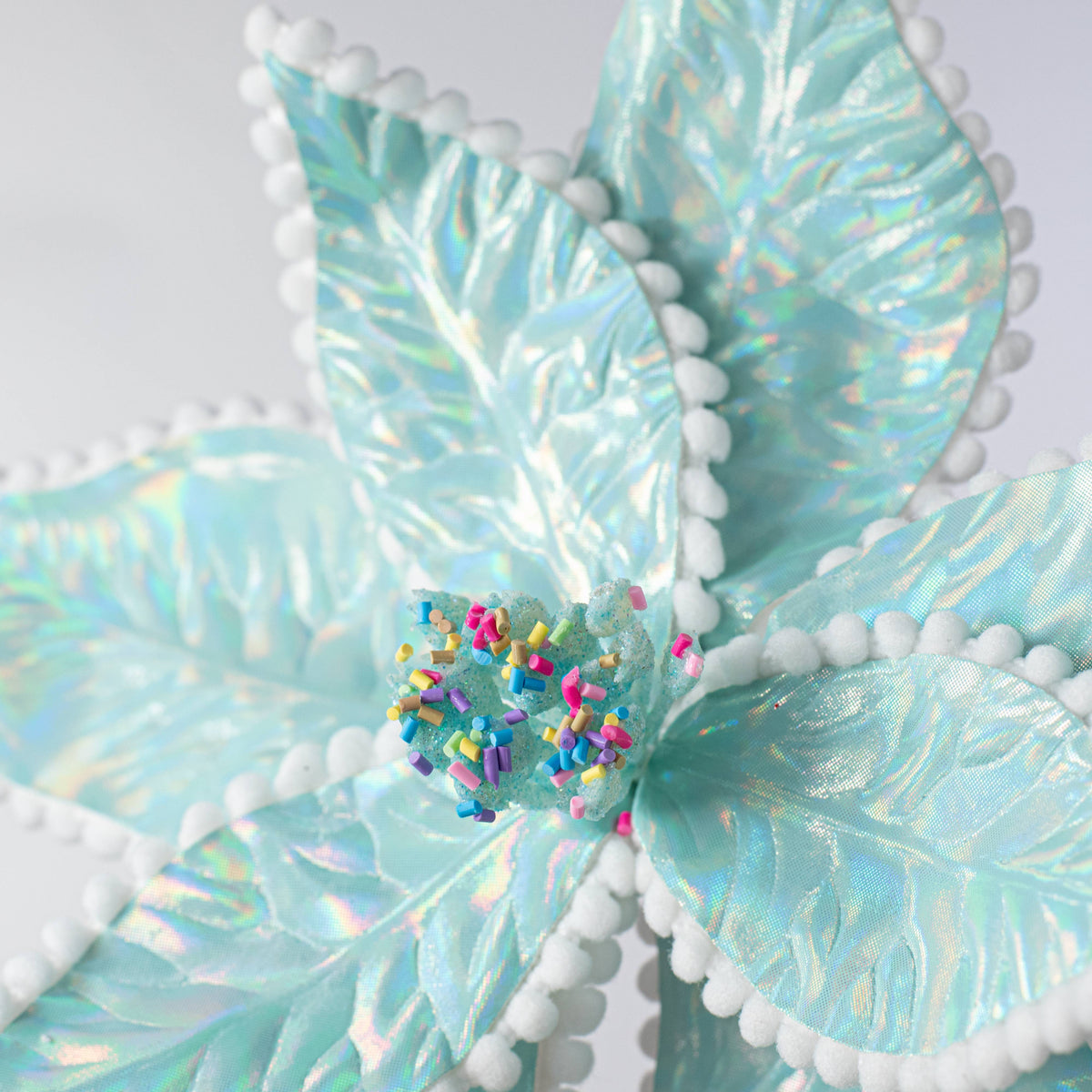 24" Iridescent Poinsettia Sprinkles Stem: Ice Blue Lifestyle Photo