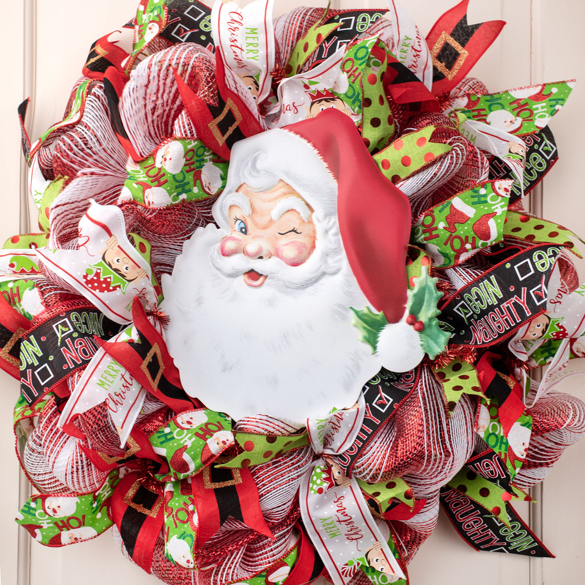 12" Metal Embossed Hanger: Winking Santa Face Lifestyle Photo