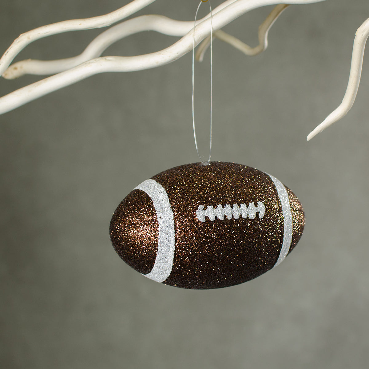 4.5" Metallic Glitter Football Ornament: Brown & White Lifestyle Photo