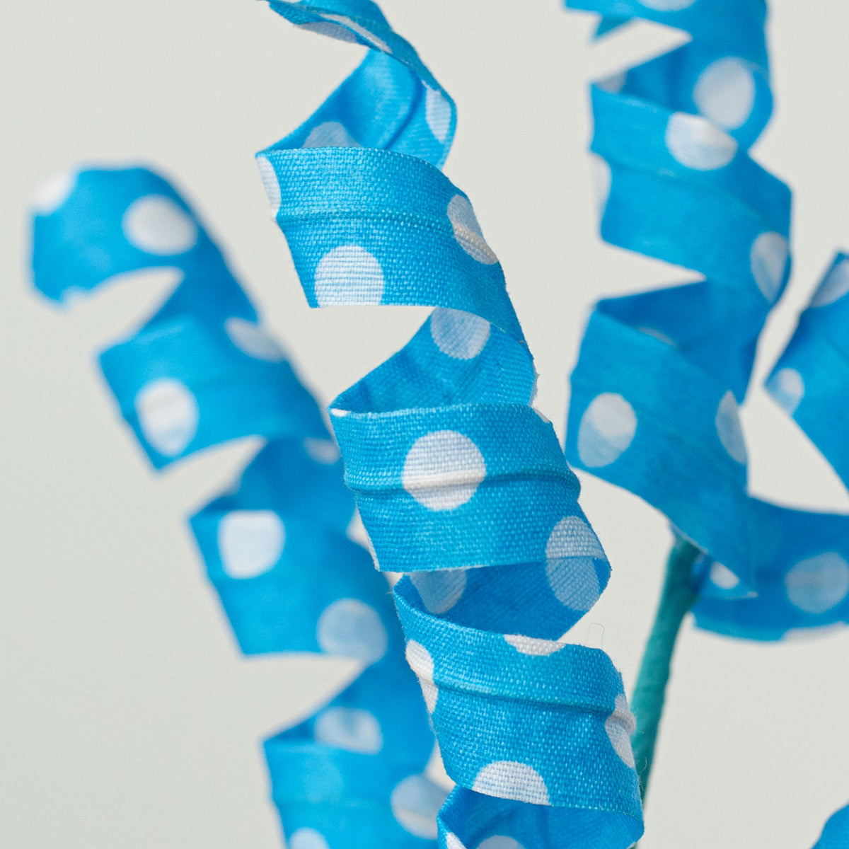 16" Polka Dot Curly Pick: Turquoise & White Lifestyle Photo