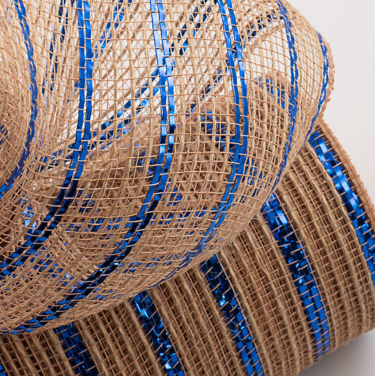 10" Poly Jute Deco Mesh: Natural & Royal Blue Metallic Stripe (10 Yards) Lifestyle Photo