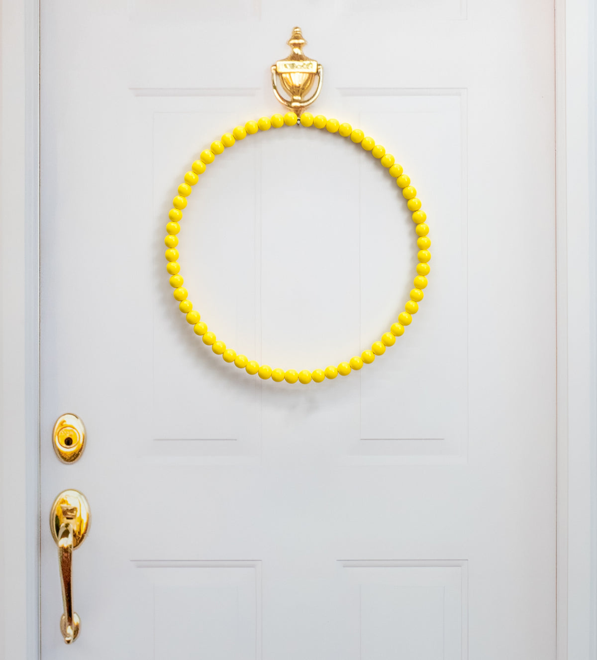 17.75" Wood Bead Wreath: Bright Yellow Lifestyle Photo