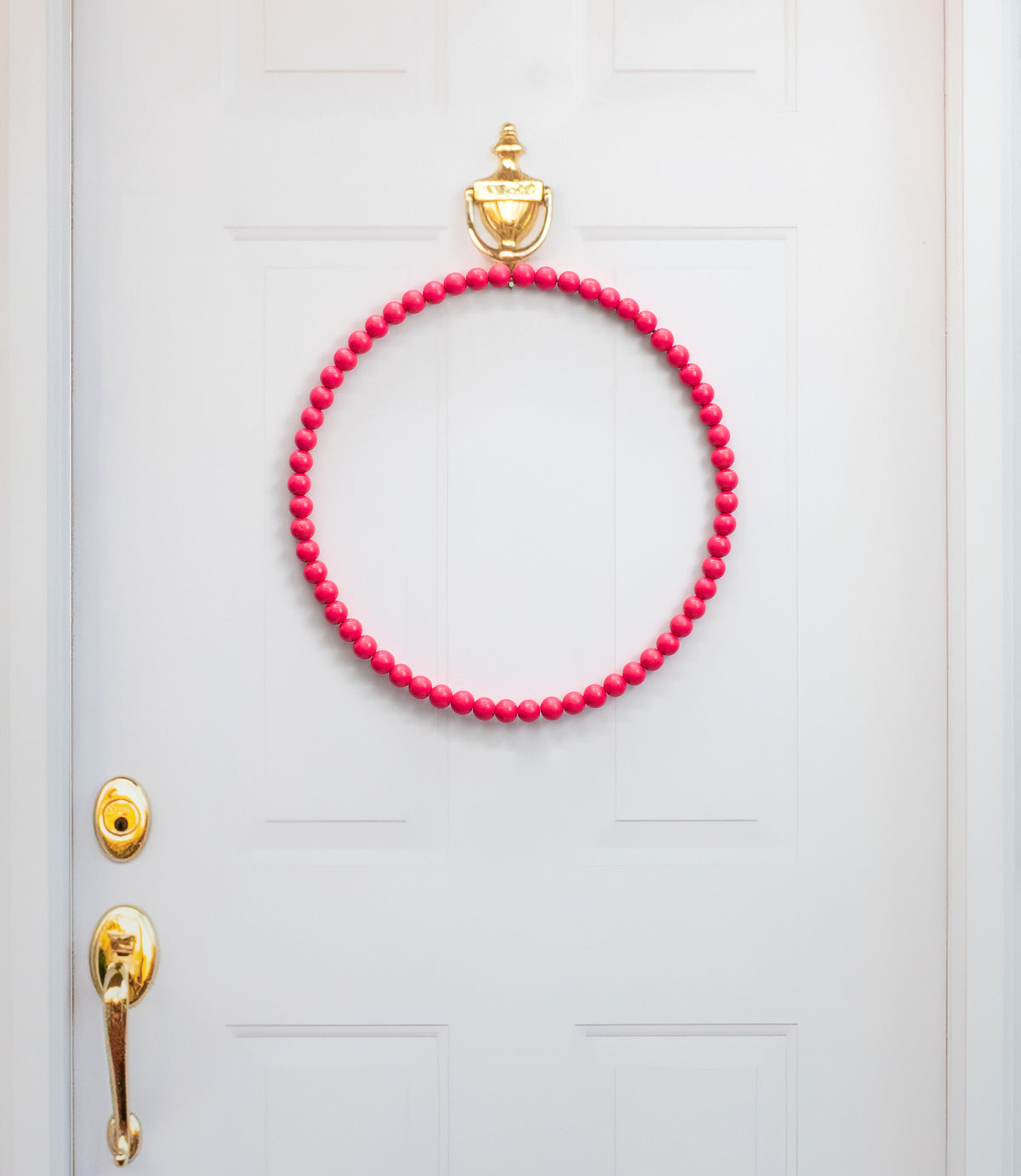 17.75" Wood Bead Wreath: Hot Pink Lifestyle Photo