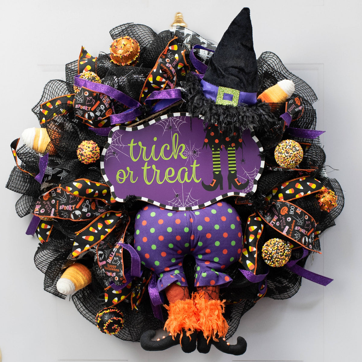 12" Wooden Scalloped Sign: Trick or Treat Witch Legs Lifestyle Photo