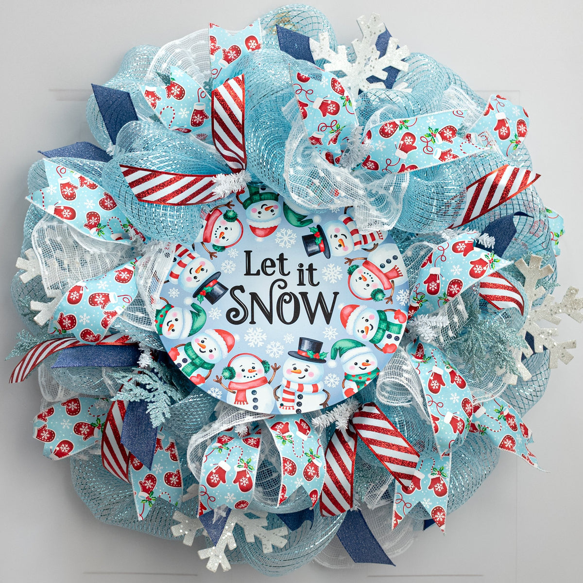12" Round Metal Sign: Blue Let it Snow Snowmen Lifestyle Photo