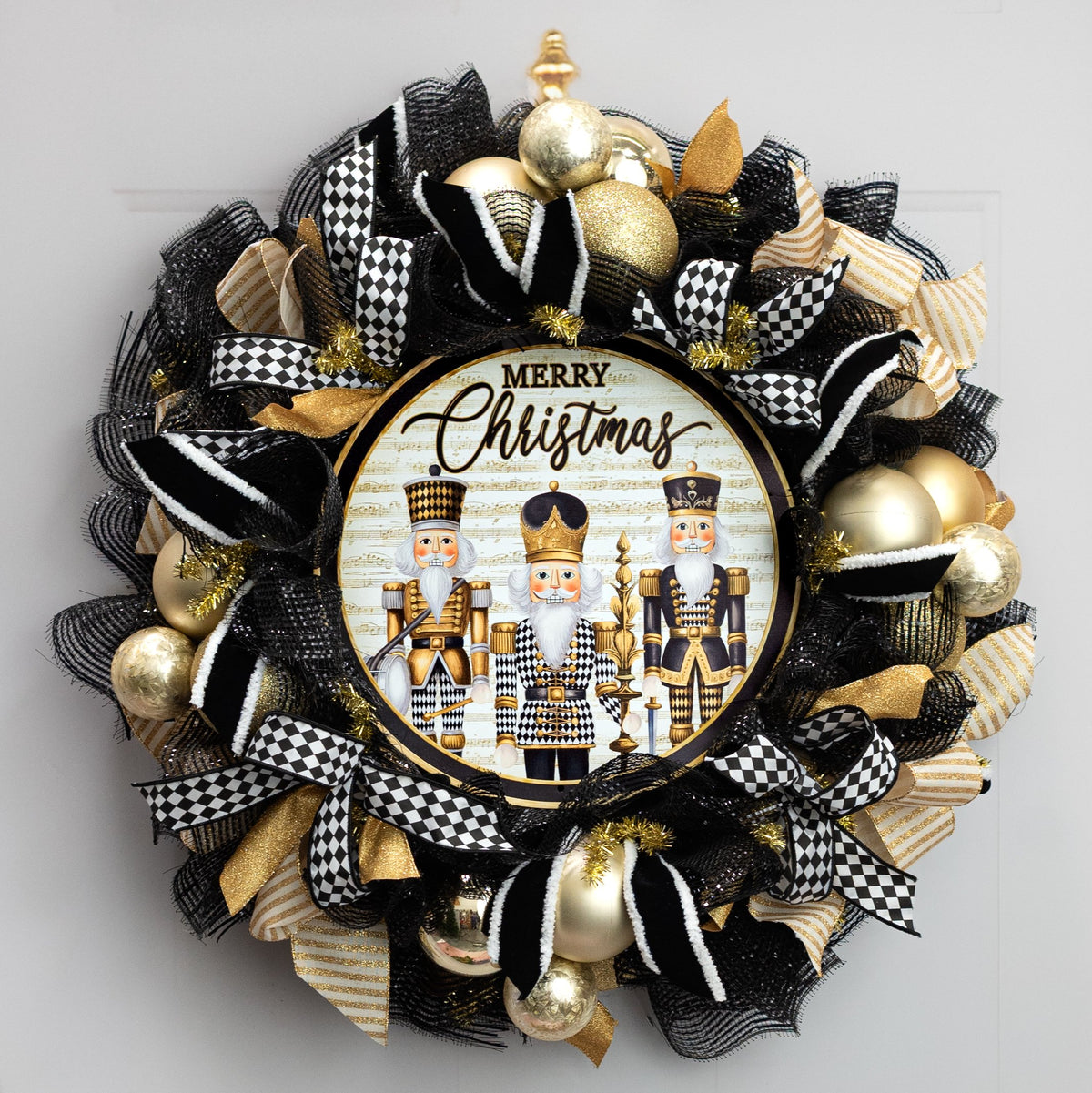 12" Round Metal Sign: Merry Christmas Harlequin Nutcrackers Lifestyle Photo