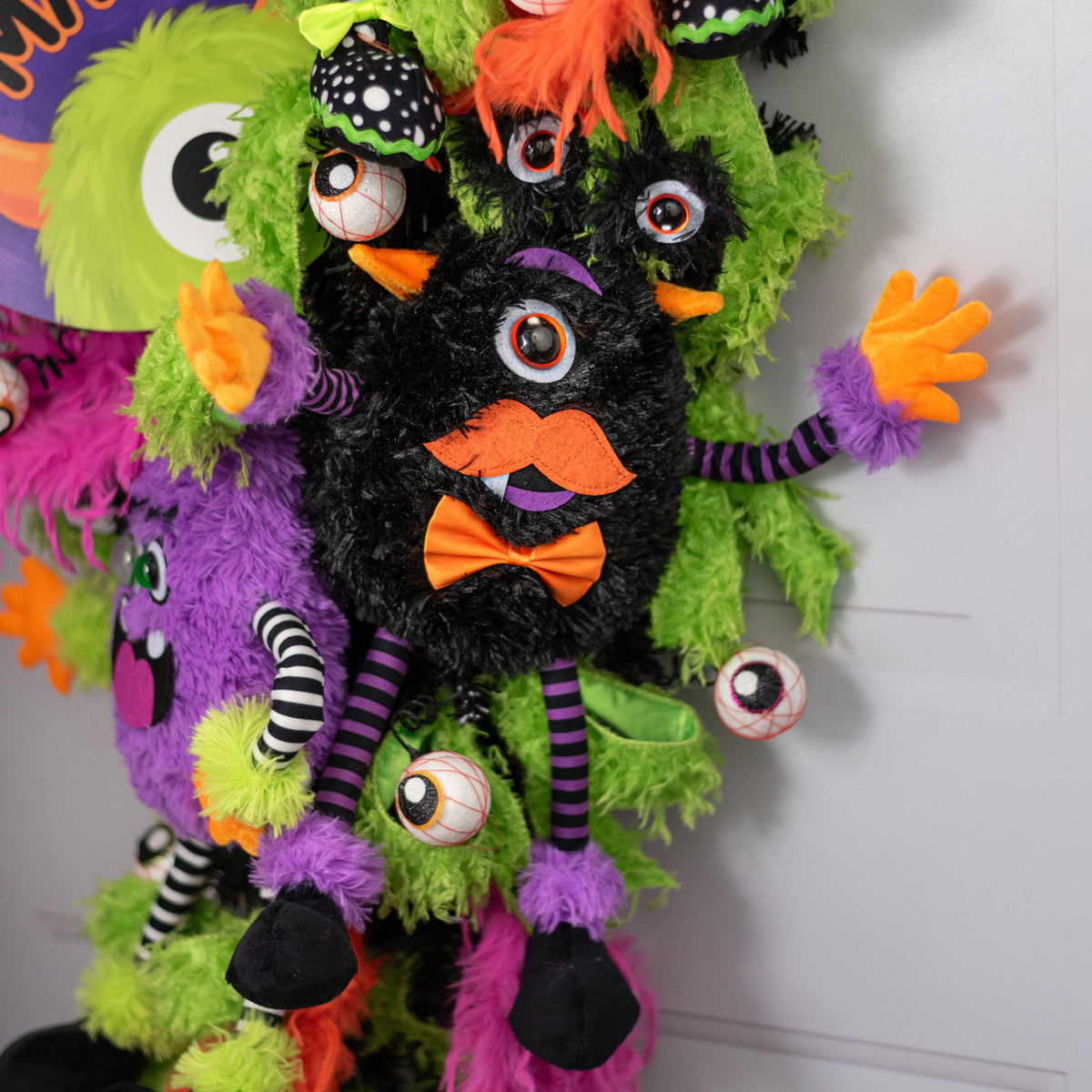 15" Plush Bow-Tie Halloween Monster Wreath Decor: Black Lifestyle Photo