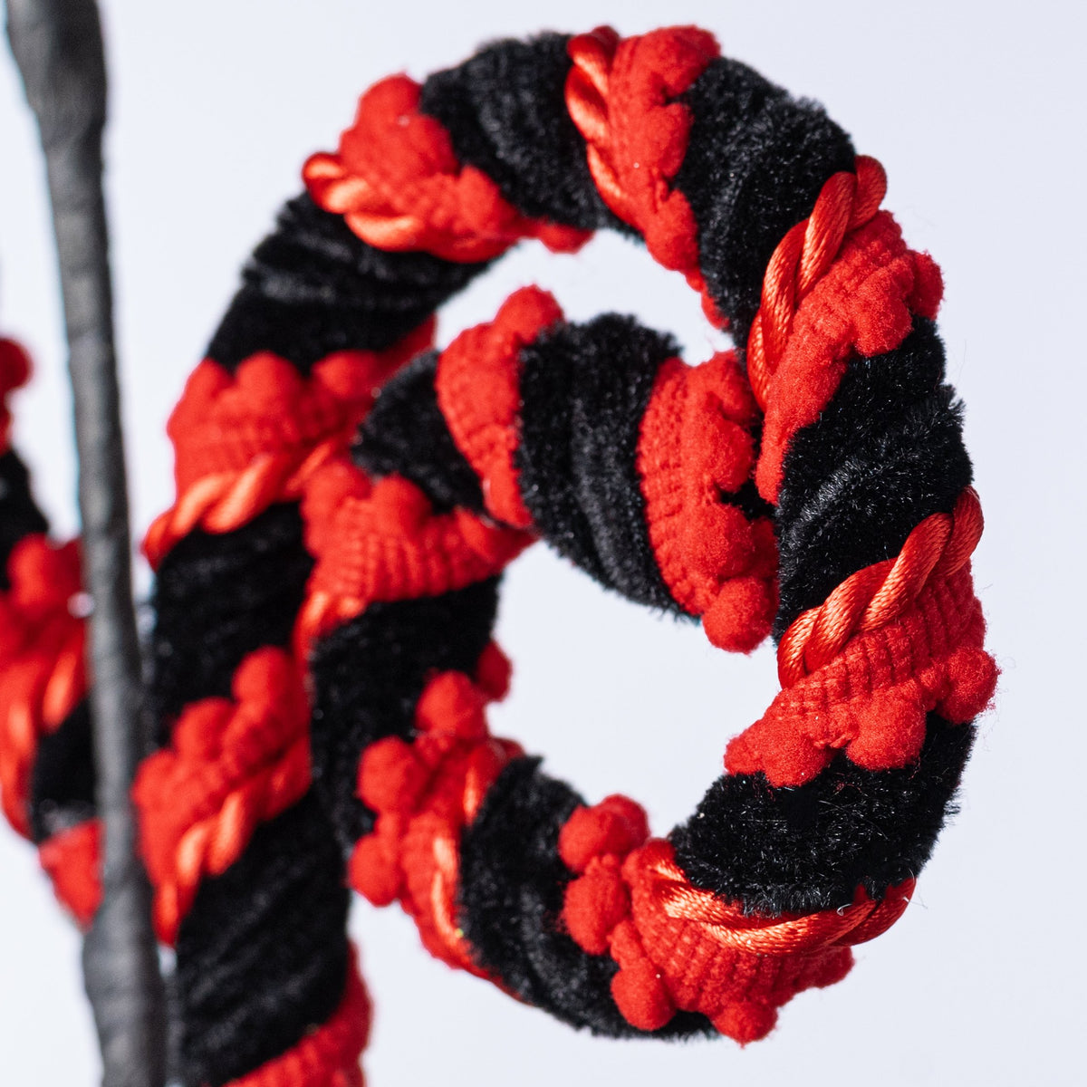 28" Chenille Pom Pom Spiral Curly Spray: Black & Red Lifestyle Photo