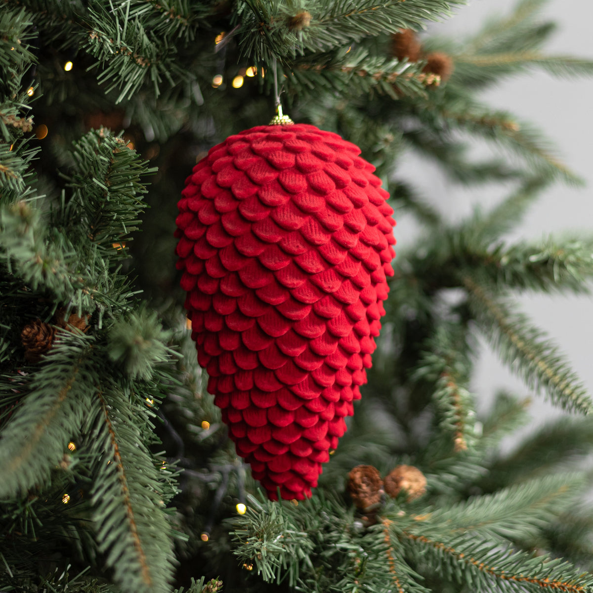9.5" Flocked Pinecone Ornament: Red Lifestyle Photo