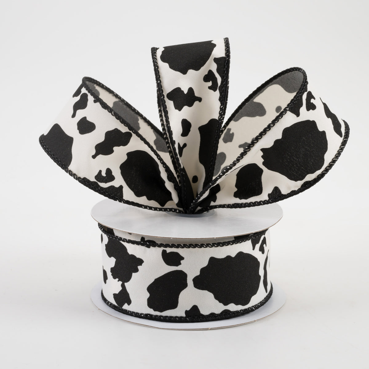 1.5" Cowhide Print Ribbon: Black & Ivory (10 Yards) Lifestyle Photo