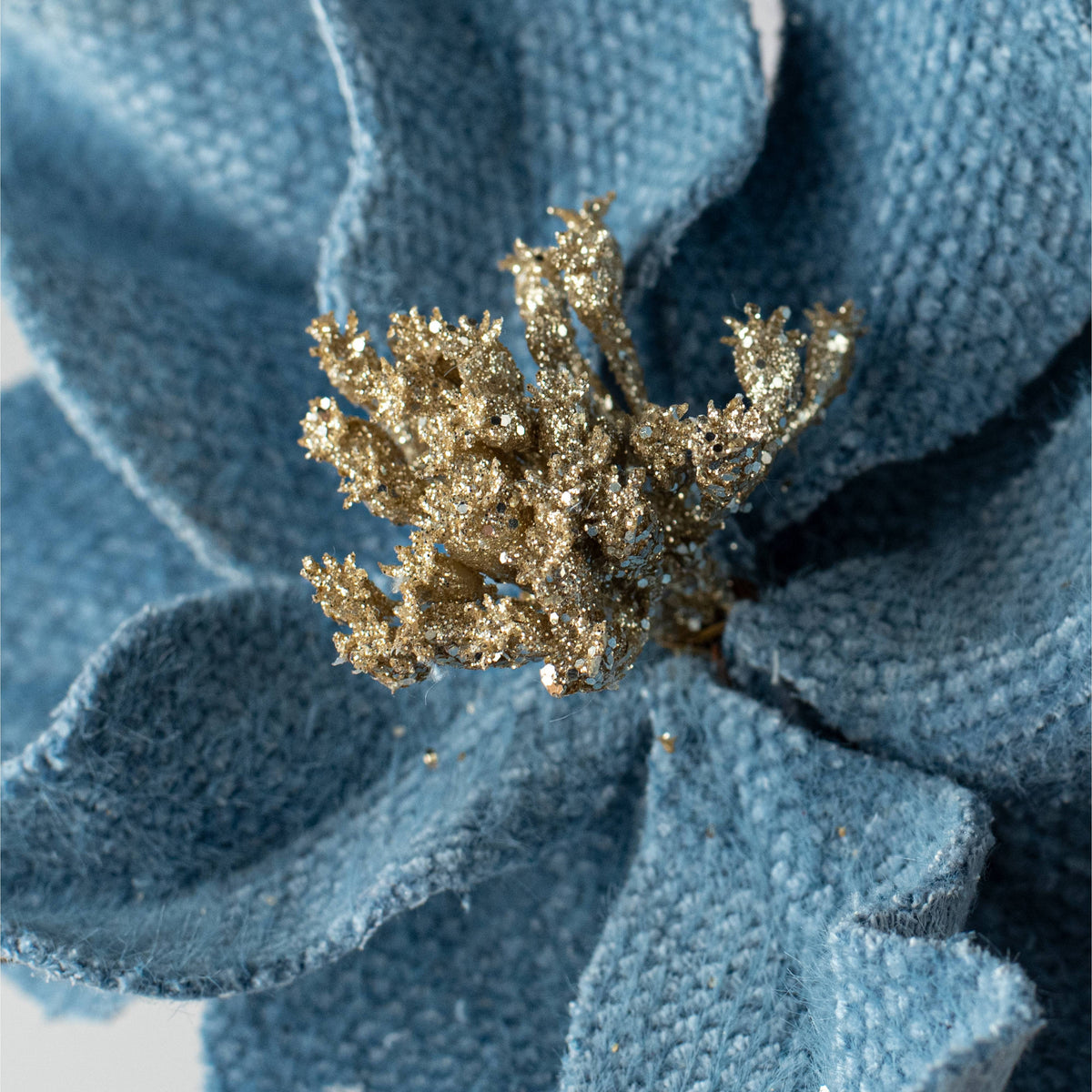 22" Fabric Poinsettia Flower Stem: Blue Lifestyle Photo