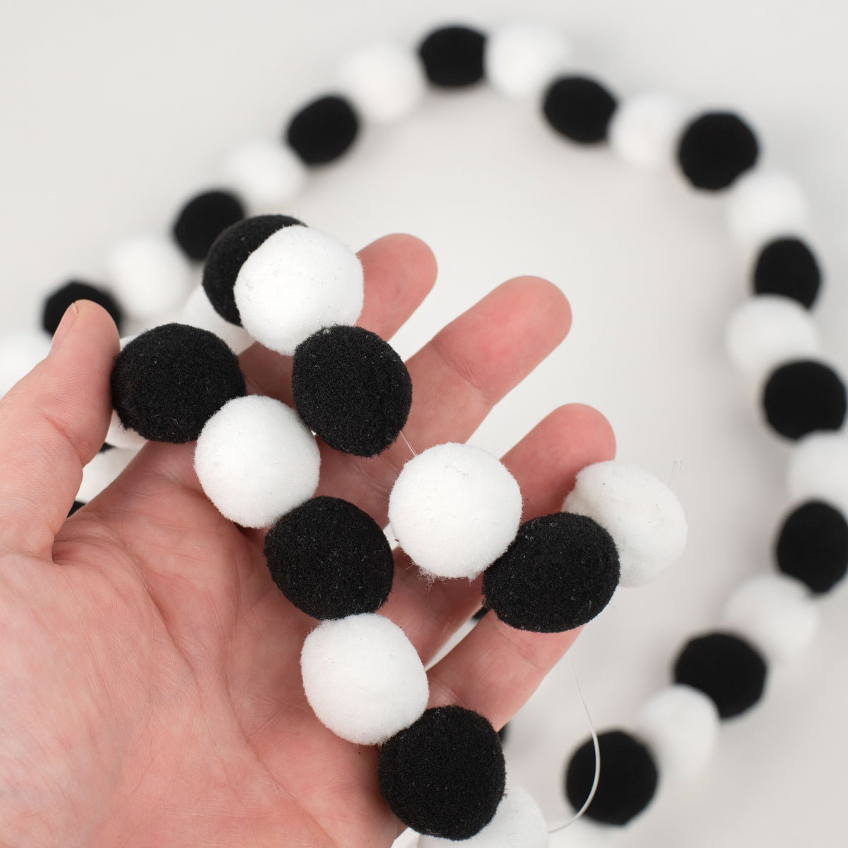 6' Felt Ball Garland: Black & White Lifestyle Photo