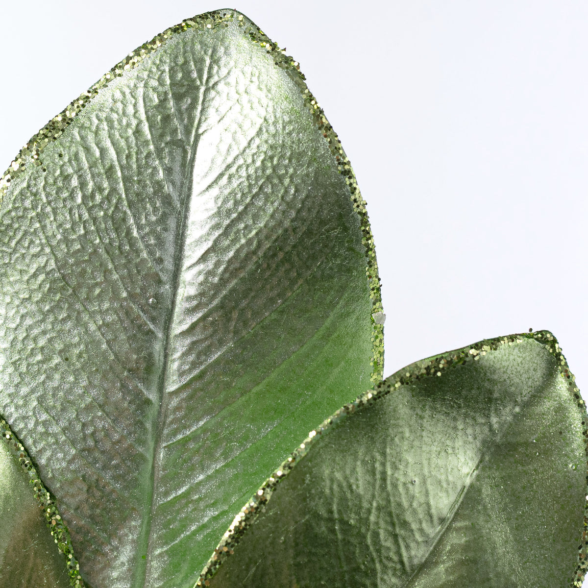 24" Metallic Magnolia Leaves Spray: Light Green
