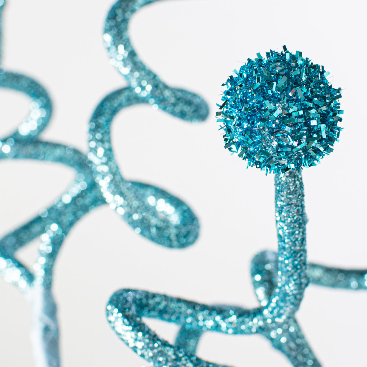 29" Glitter Swirl Ball Ornament Spray: Light Blue Lifestyle Photo