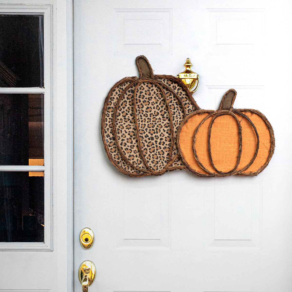 26" Grapevine Hanger: Leopard & Pumpkin Orange Pumpkins Lifestyle Photo