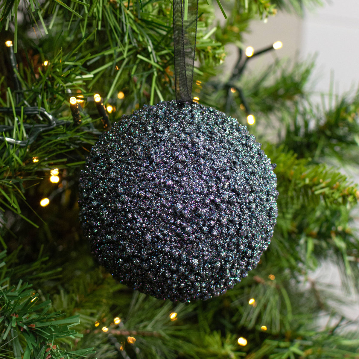 4" Iridescent Glitter Ball Ornament: Dark Navy Blue (Box of 4) Lifestyle Photo