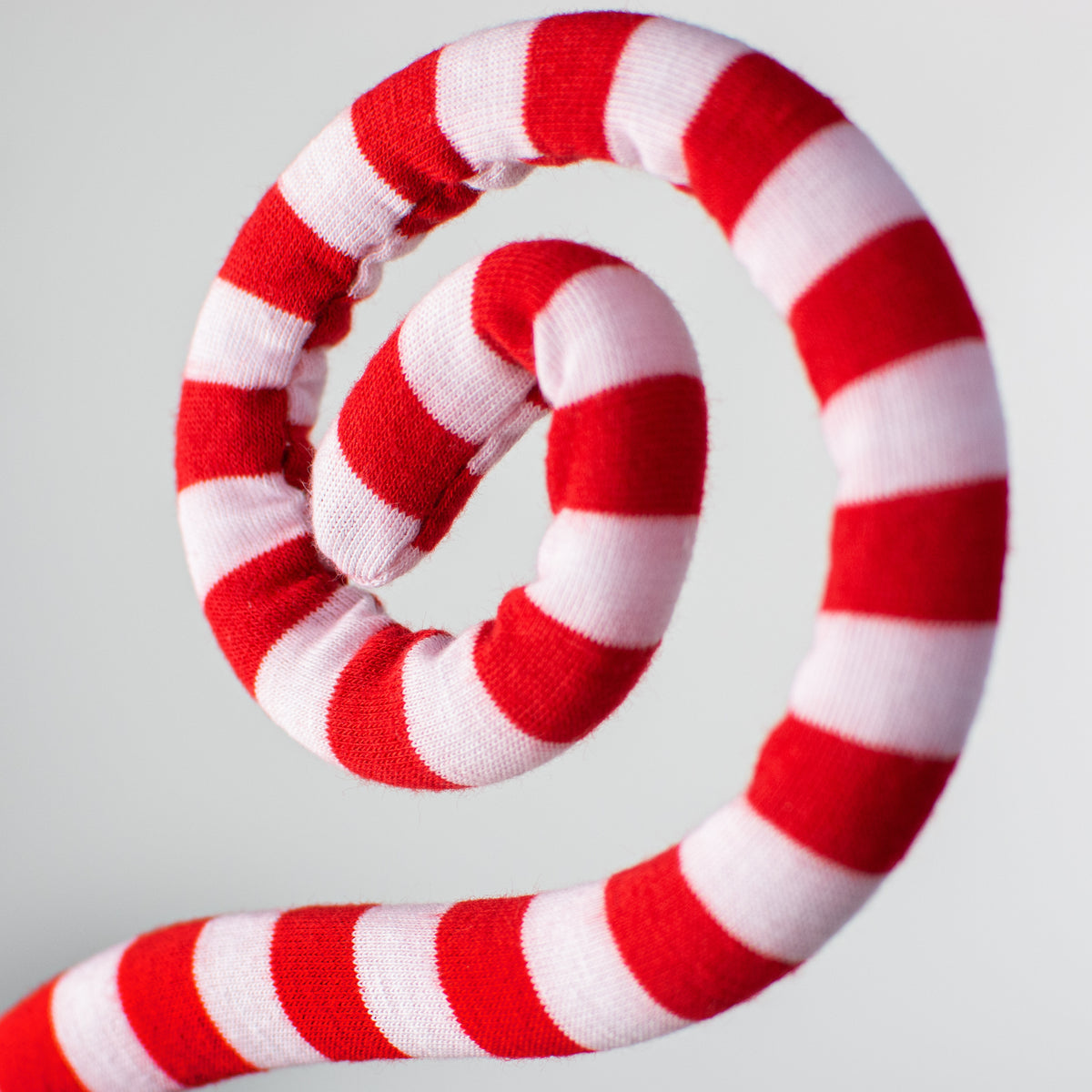 30" Knit Fabric Peppermint Spiral Curly Spray: Red & White Lifestyle Photo