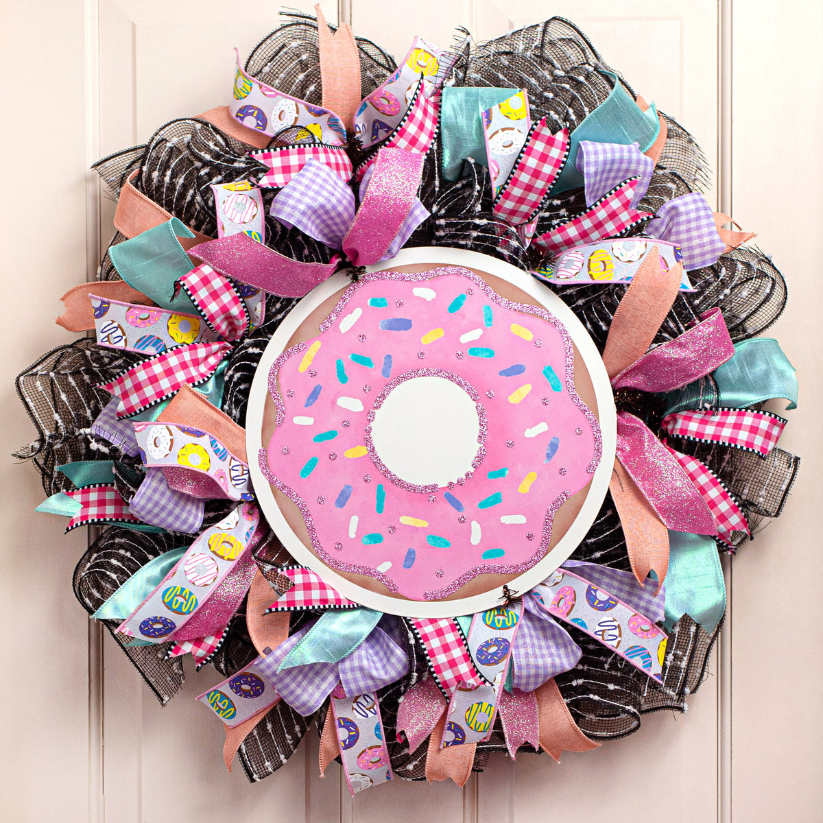 12" Metal Sign: Glitter Pink Donut Lifestyle Photo