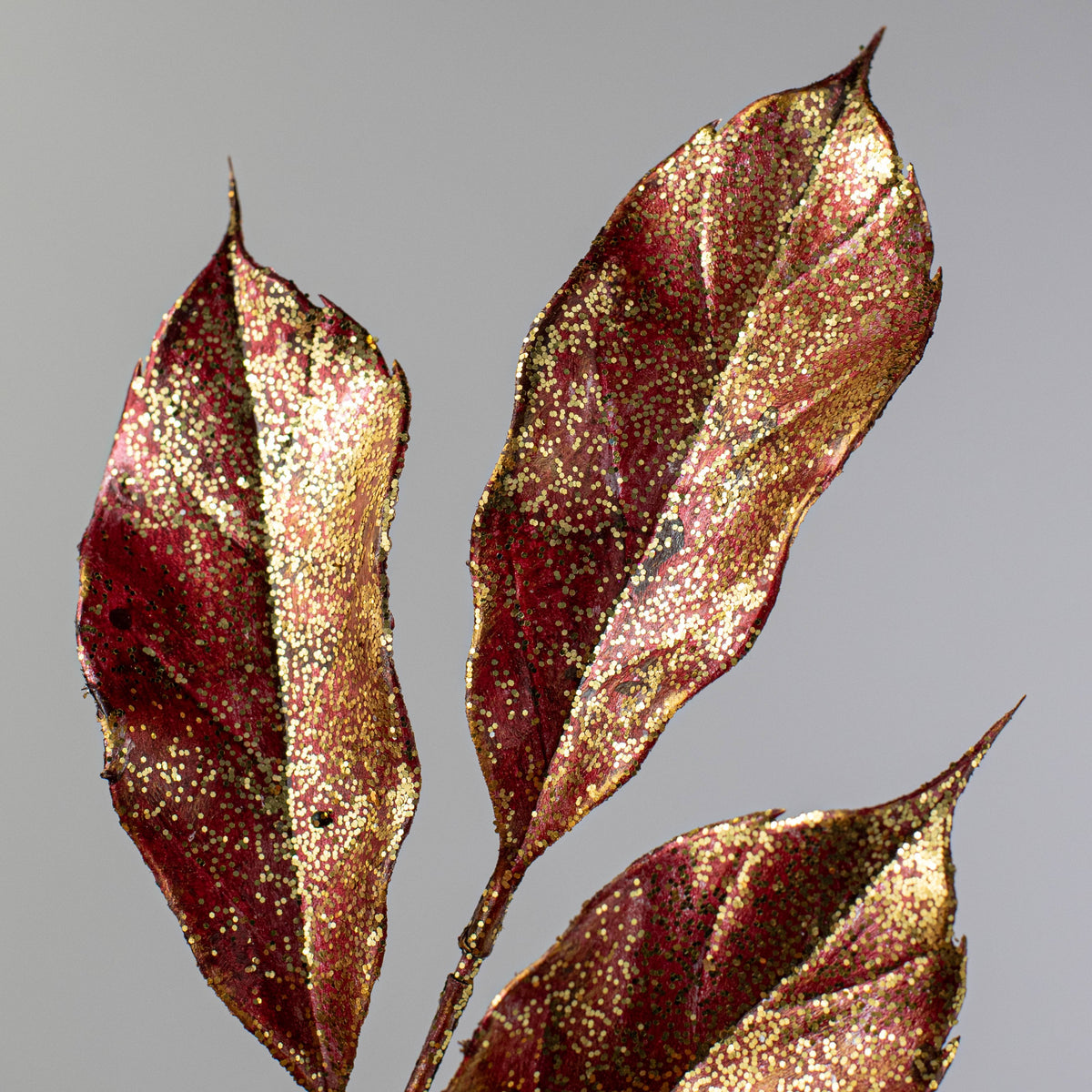 28" Metallic Magnolia Leaves Spray: Burgundy & Gold Lifestyle Photo