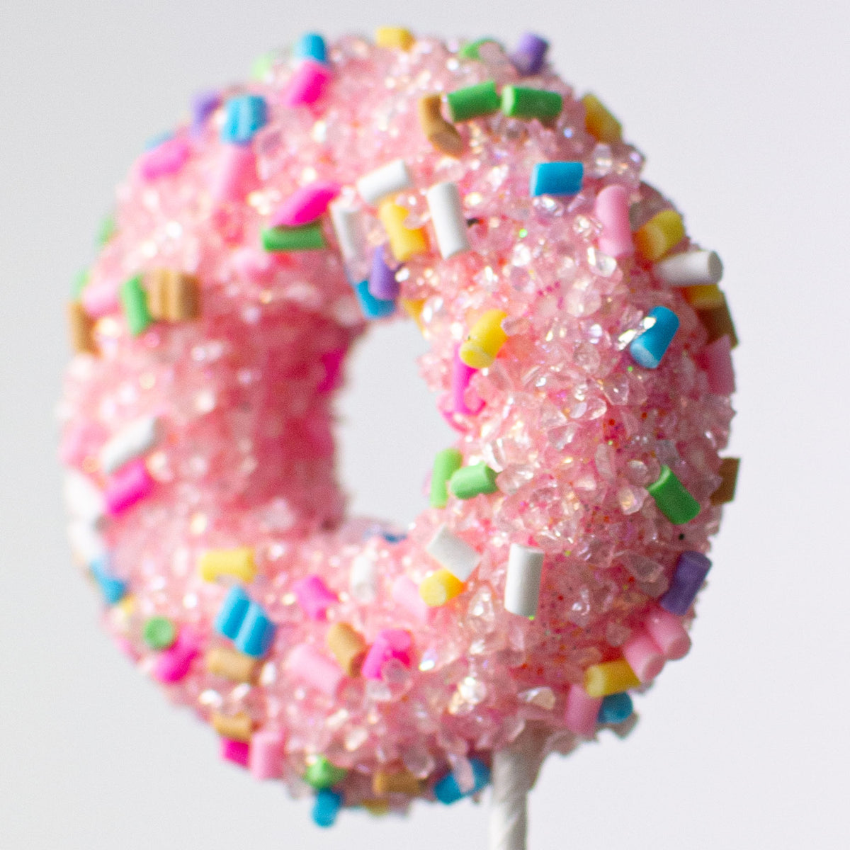 24" Pastel Rainbow Donut Spray Lifestyle Photo