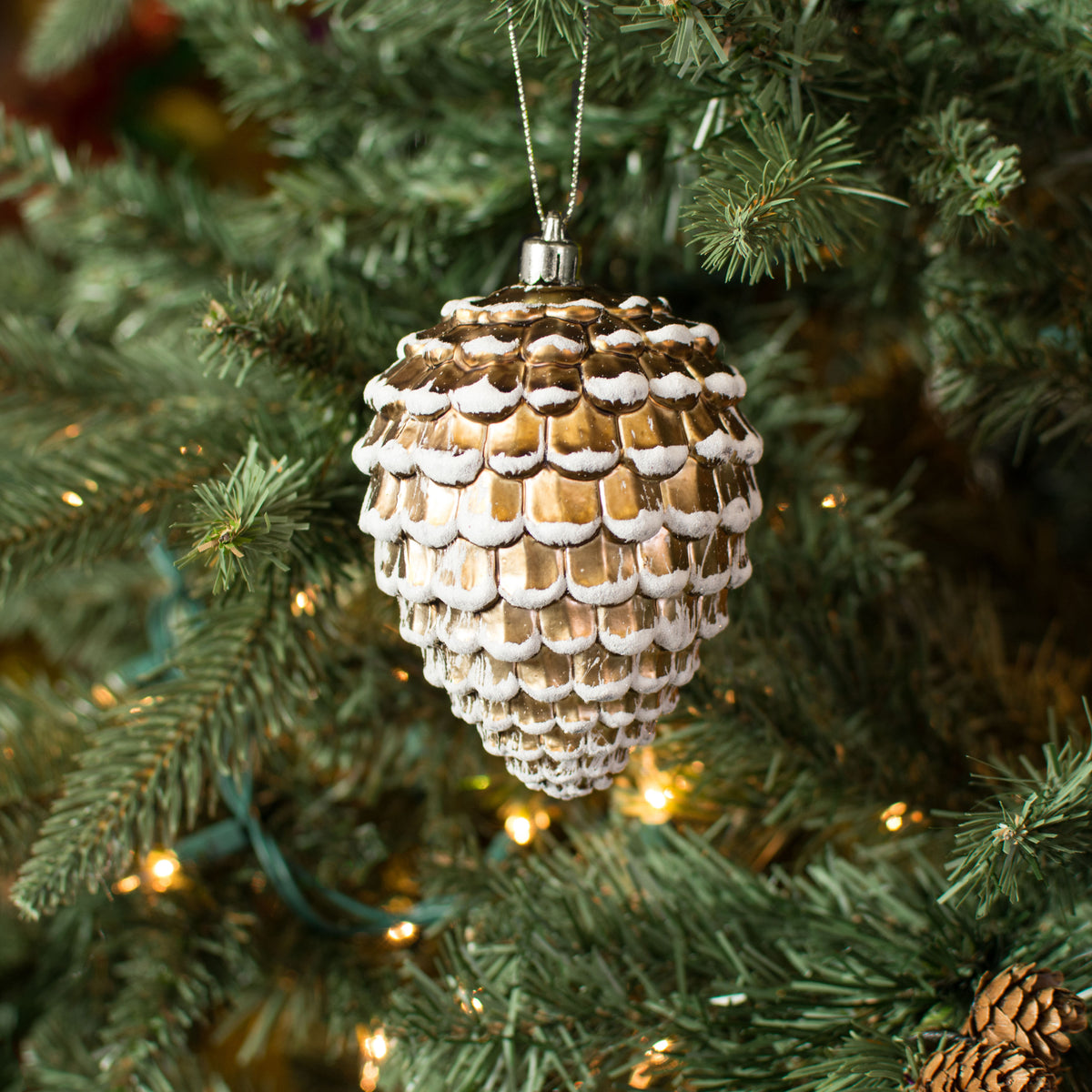 4.5" Pinecone Ornament: Brown With Snow Lifestyle Photo