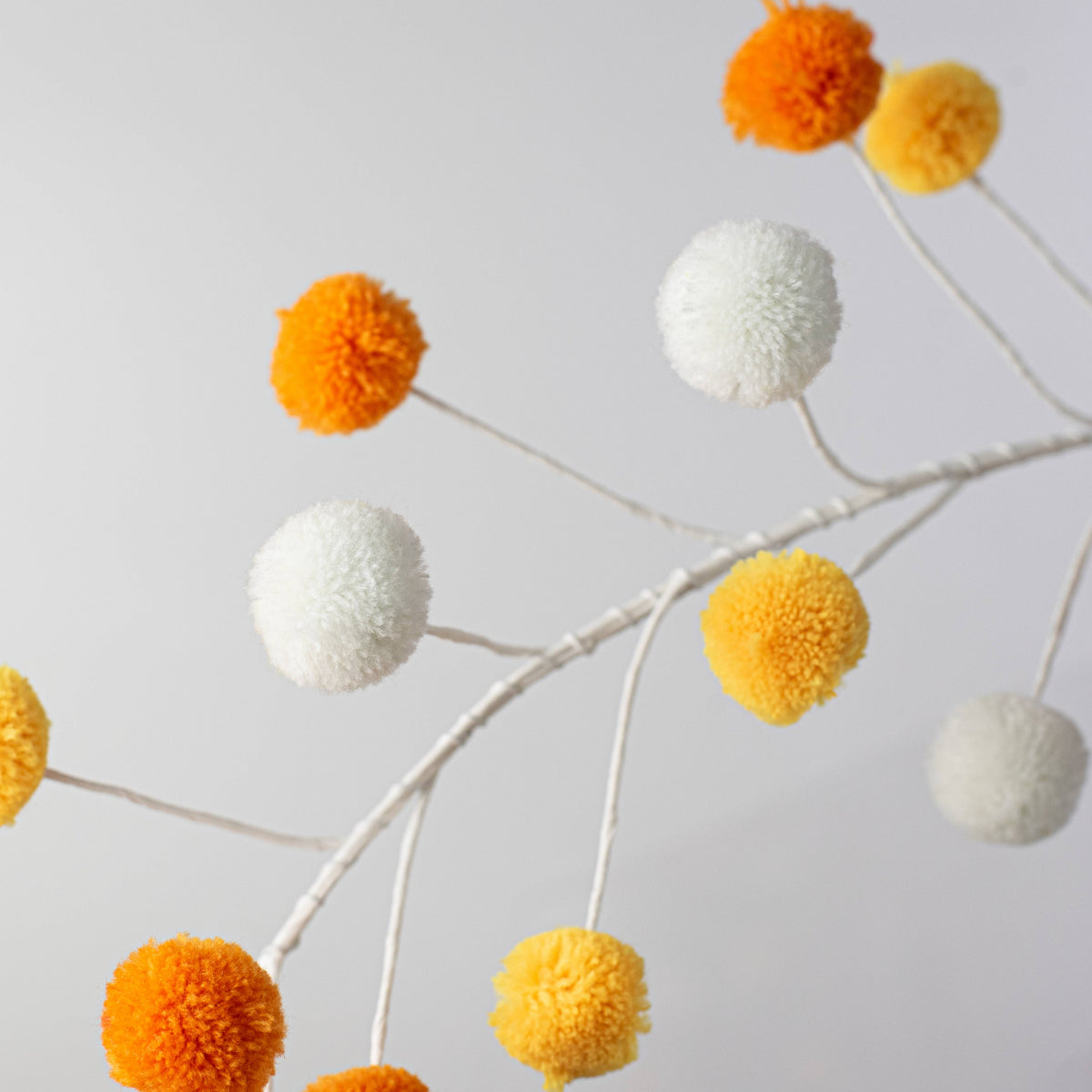 5' Pom Pom Wire Garland: Candy Corn Hues detail photo 3
