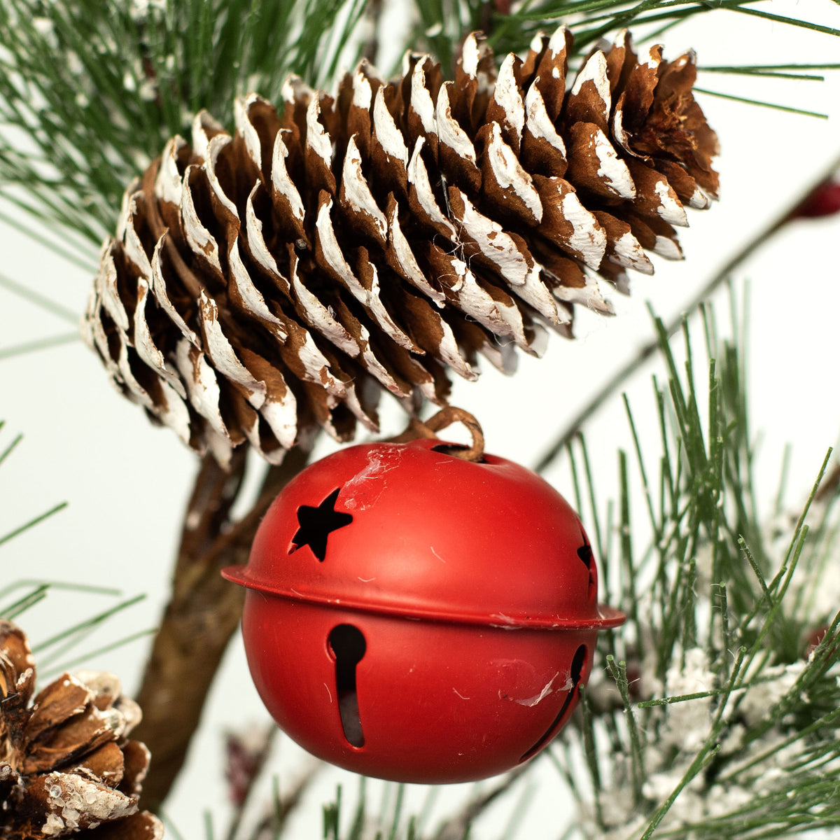 28" Snow Pine, Pinecone, & Red Bell Spray Lifestyle Photo