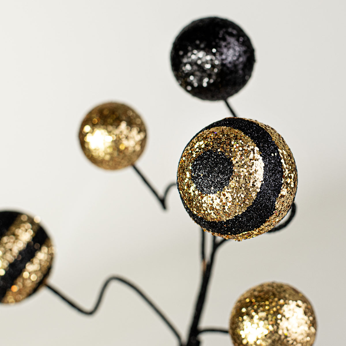 17" Stripe & Solid Glitter Ball Pick: Black & Gold Lifestyle Photo